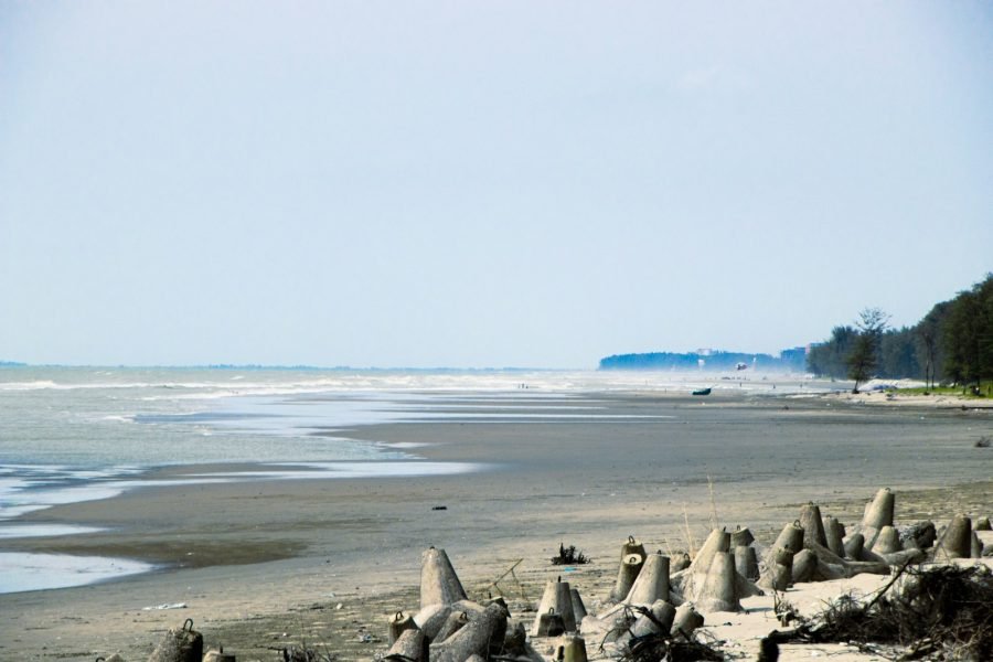 A sandy beach with lots of sand and water